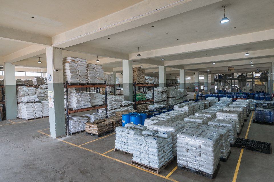 Raw material storage at Kelvin Bio Organics — drummed and sacked raw materials