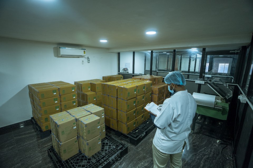 Palletised finished goods in the Kelvin Bio Organics warehouse being checked before dispatch